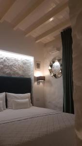 Postel nebo postele na pokoji v ubytování Room Del Giglio