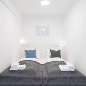 Łóżko lub łóżka w pokoju w obiekcie Luxury Suites Liechtenstein