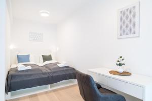 Łóżko lub łóżka w pokoju w obiekcie Luxury Suites Liechtenstein