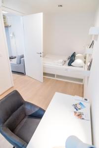 Łóżko lub łóżka w pokoju w obiekcie Luxury Suites Liechtenstein