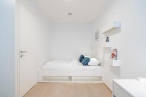 Łóżko lub łóżka w pokoju w obiekcie Luxury Suites Liechtenstein
