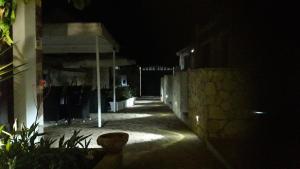 a dark alley with a building at night at Villa Lucia in Lampedusa