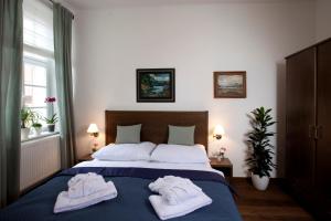 Postelja oz. postelje v sobi nastanitve Apartmány Šupina