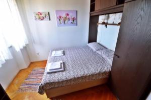 Postel nebo postele na pokoji v ubytování Apartman Martina