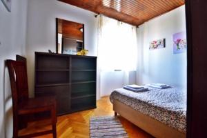 Postel nebo postele na pokoji v ubytování Apartman Martina