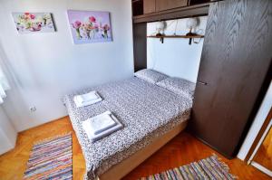 Postel nebo postele na pokoji v ubytování Apartman Martina