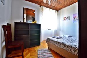Postel nebo postele na pokoji v ubytování Apartman Martina