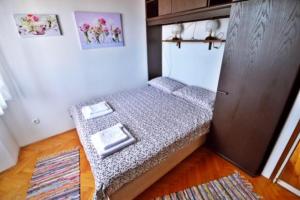 Postel nebo postele na pokoji v ubytování Apartman Martina