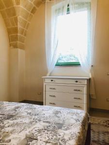 A bed or beds in a room at Le Tre Meraviglie