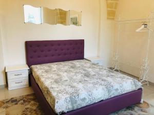 A bed or beds in a room at Le Tre Meraviglie
