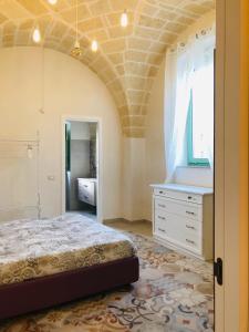 A bed or beds in a room at Le Tre Meraviglie