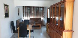 a living room with a couch and a table at FMM Apartamentos Costa Blanca Playa DOS HABITACIONES in Benidorm