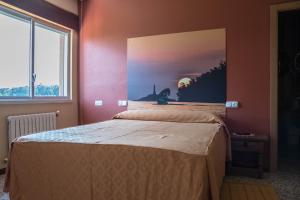 Cama o camas de una habitación en Hotel Galicia