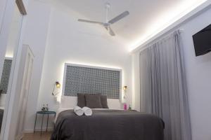 Postel nebo postele na pokoji v ubytování GOMEZ ROOMS