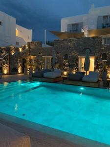 
a hotel room with a pool and a swimming pool at Apiro Mykonos in Mýkonos City
