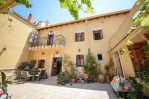 a courtyard in a house with potted plants at ARCHANES APPARTMENT in Archanes