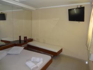 Кровать или кровати в номере Hotel Gomes Freire (Только для взрослых)