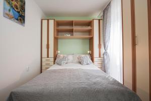 Posteľ alebo postele v izbe v ubytovaní Apartment Pax