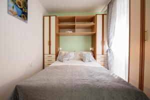 Posteľ alebo postele v izbe v ubytovaní Apartment Pax