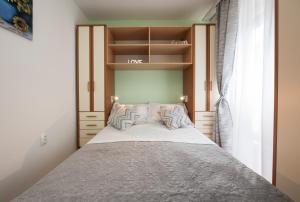 Posteľ alebo postele v izbe v ubytovaní Apartment Pax