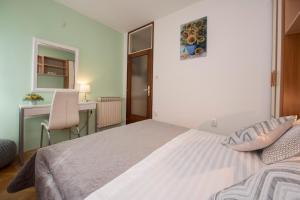 Posteľ alebo postele v izbe v ubytovaní Apartment Pax
