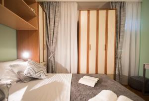 Posteľ alebo postele v izbe v ubytovaní Apartment Pax