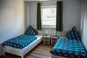 Gulta vai gultas numurā naktsmītnē Barrierefreie Ferienwohnung Trüben (Zerbst/Anhalt)