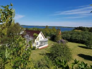 an aerial view of a white house with a flag at Birkely Bed and Breakfast in Stege