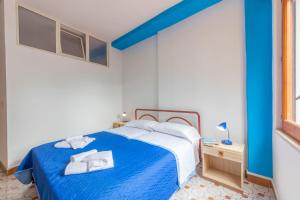 Un pat sau paturi într-o cameră la Hotel Il Villaggio Lì Cylentos