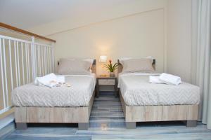 Ein Bett oder Betten in einem Zimmer der Unterkunft Vasilicos Sea Stay