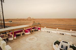 a view of the pyramids from the top of a building at Desert Moon in Cairo