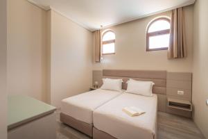 Postel nebo postele na pokoji v ubytování PALMA city HOTEL