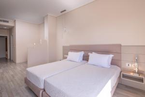 Postel nebo postele na pokoji v ubytování PALMA city HOTEL
