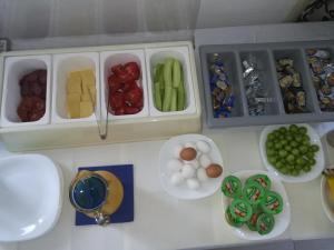 a toy kitchen with vegetables and other food items at Art B in Ohrid +42 photos