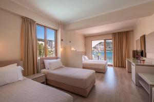 Postel nebo postele na pokoji v ubytování PALMA city HOTEL