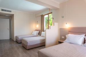 Postel nebo postele na pokoji v ubytování PALMA city HOTEL