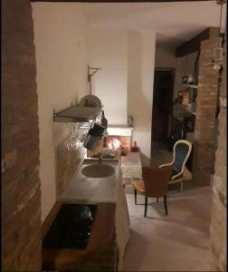 a living room with a fireplace and a fish pond at La Dimora del Cont'Orto in Giulianova +47 photos