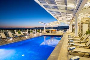 a swimming pool on the roof of a building at Hotel Villa Varadero in Nuevo Vallarta