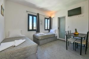 Postelja oz. postelje v sobi nastanitve Sun Springs Suites