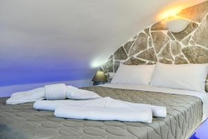 Postelja oz. postelje v sobi nastanitve Sun Springs Suites