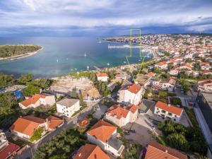 an aerial view of a city and a body of water at Apartments Karolina in Novalja