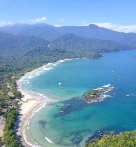 an aerial view of a beach and the ocean at Vila Pequeá Ilhabela in Ilhabela