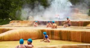 a group of people sitting in a water fountain at Haciely Thermal Otel in Denizli