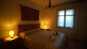 Postel nebo postele na pokoji v ubytování Residenza Su Prelau