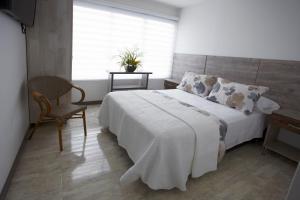 Postel nebo postele na pokoji v ubytování ARI Hotel