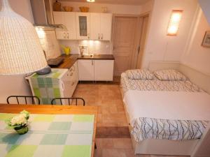 Kuchyň nebo kuchyňský kout v ubytování Apartments Mediteranea