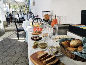 a table with bread and other food on it at Casa Fusion Hotel Boutique in La Paz