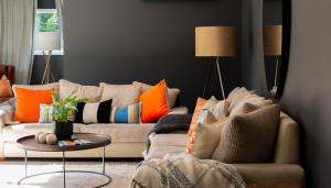 a living room with a couch and a table at Queenstown Country Lodge in Queenstown