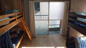 Postel nebo postele na pokoji v ubytování GUEST HOUSE SaKURa
