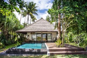 a villa with a swimming pool in a resort at Kalinaw Resort in General Luna